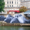 Affichage de JR sur l\'Île Saint-Louis à Paris dans le cadre de son projet